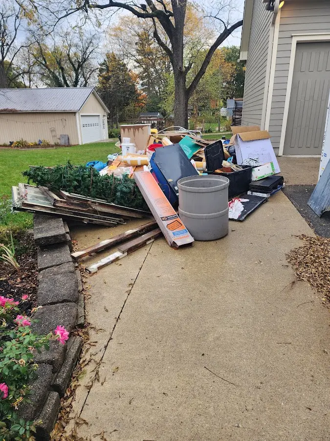 Dumpster being loaded with debris for 3 Yard Dumpster Rental in Simsbury
